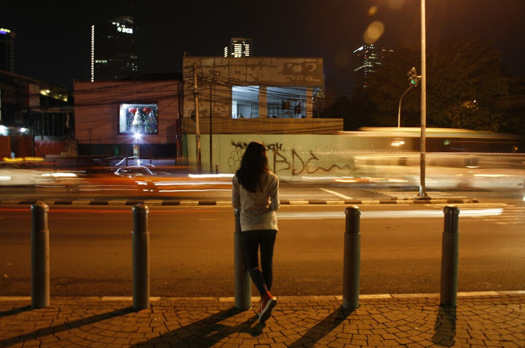 woman walking alone at night